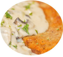 Breaded Chicken Escolope with a garlic and mushroom cream sauce.